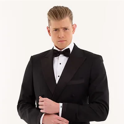 The Undertaker: A classic black tuxedo, with a modern, double-breasted flair.